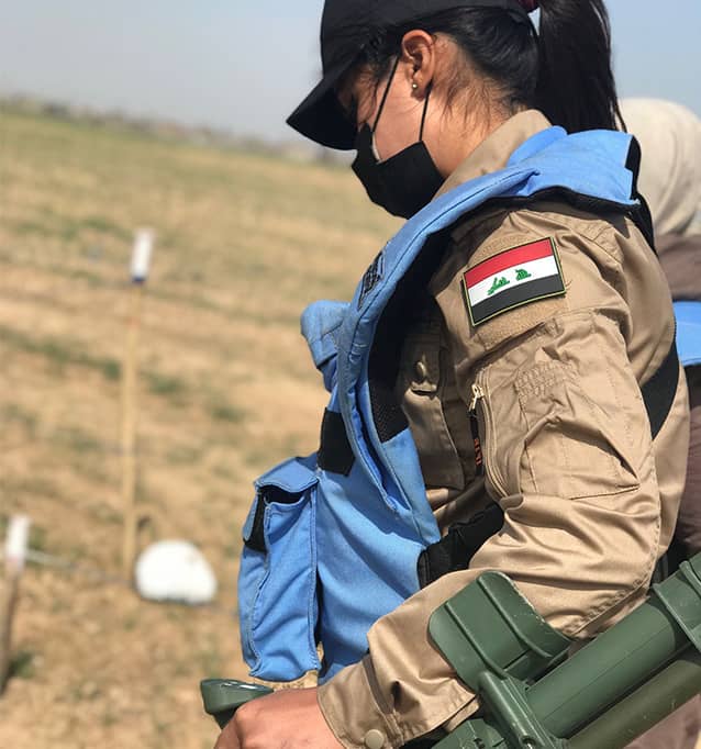 Noor using her metal detector.