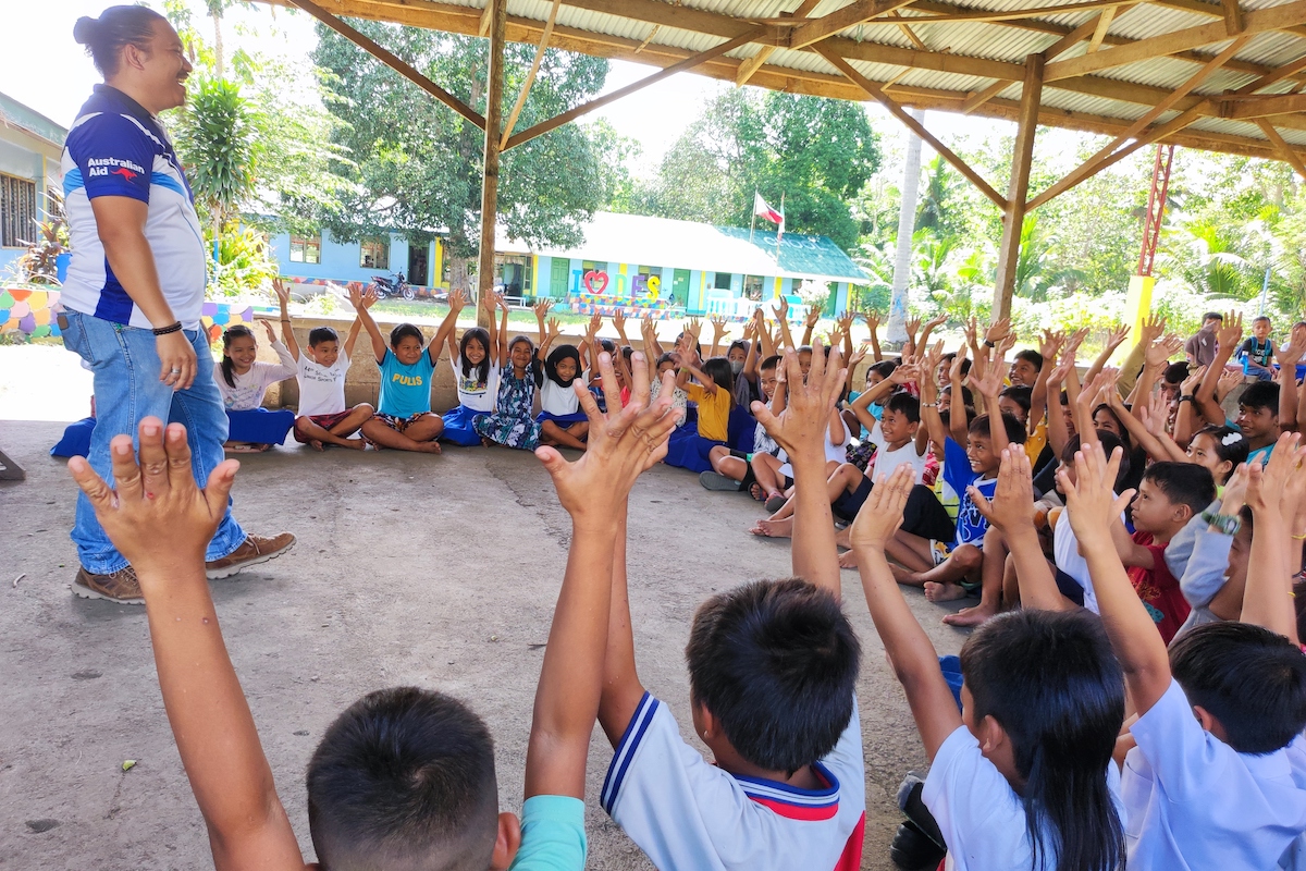 FSD Volunteer having an energizer to the children upon conducting EORE session