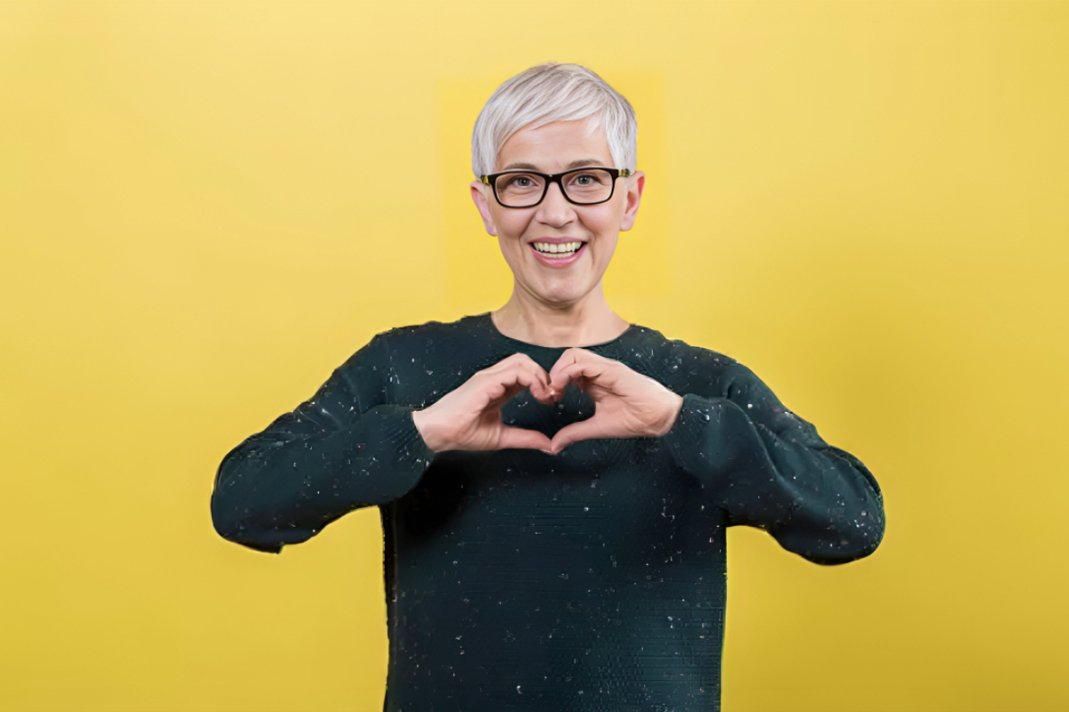 woman signing heart with her hands
